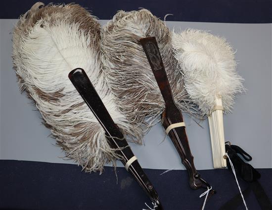 Two female ostrich feather fans and a small white ostrich feather fan,